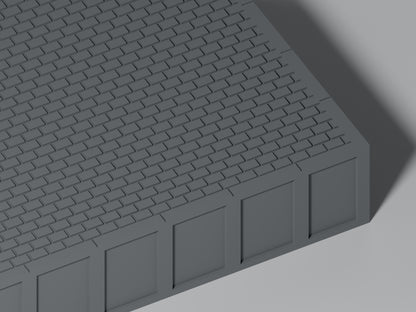 Detailansicht: Bahnsteig H0 · Epoche III/IV · Endstück mit Stirnkante · 200 × 65 mm · Pflasterfugen und Bahnsteigkante. Einfarbig grau, unbemalt. Visualisierung.